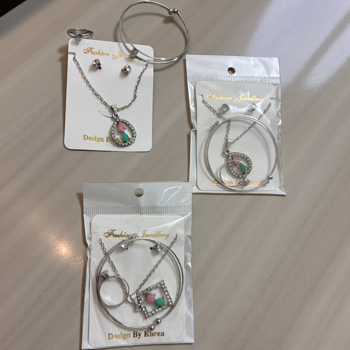 Silver Plated AD Stone Heart Pendant Chain Necklace, Earrings Set & Adjustable Bracelet Combo (Pack of 3 Set Mixed)
