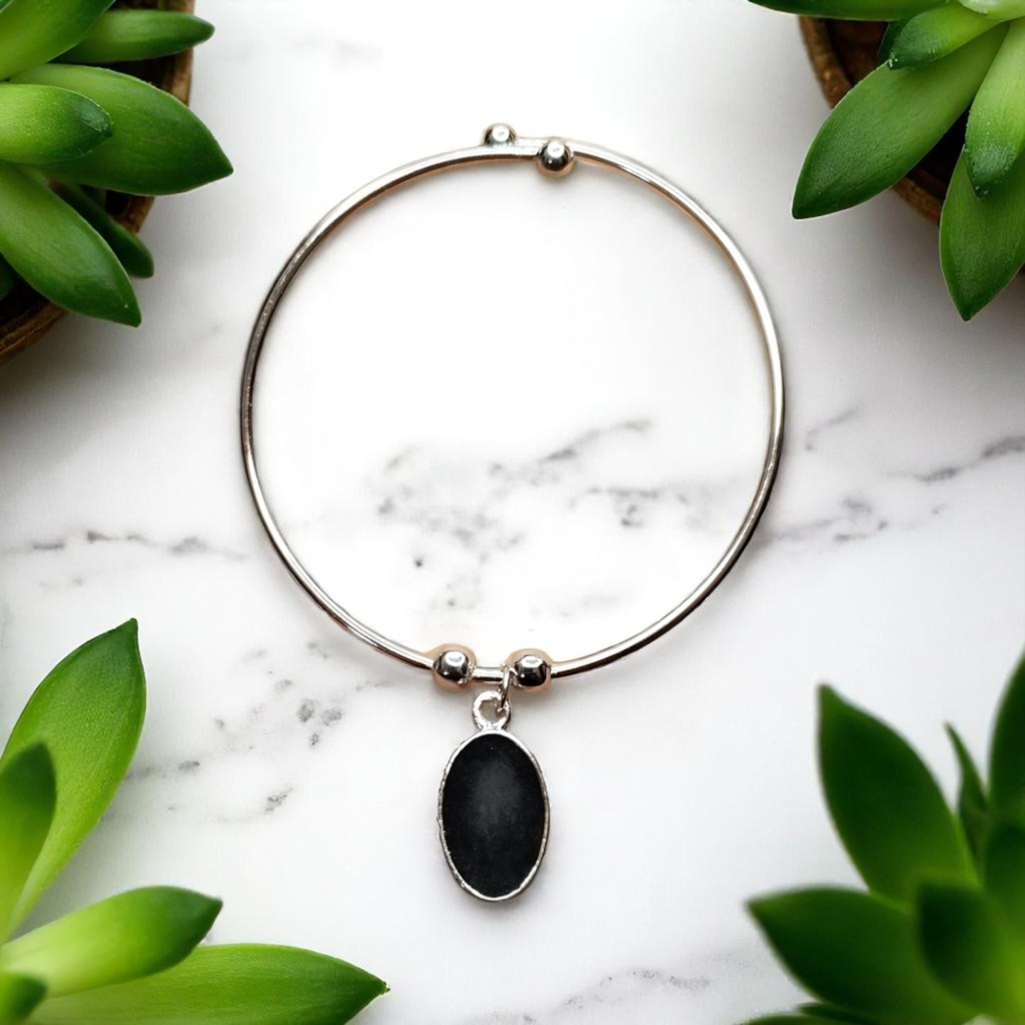 Fancy Stone Bracelet with Black Oval Charm